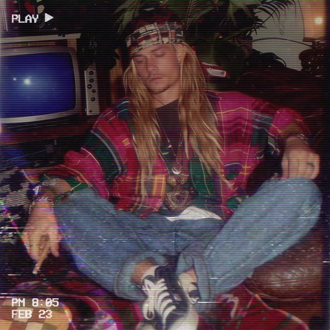 An individual who appears to be in a state of deep relaxation or asleep, evoking a sense of being heavily under the influence, possibly due to the blunt that they are holding. They are slouched on a leather couch, sporting a 90s-inspired outfit with a colorful patterned jacket and a bandana headband, eyes closed and mouth open slightly, which suggests that they have dozed off. Their loose jeans and sneakers add to the laid-back vibe. The setting includes a retro television in the background, co…